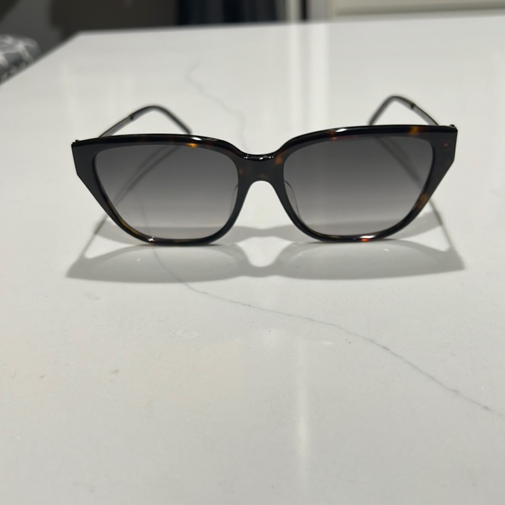 YSL women sunglasses, slightly cat eye, excellent/like new, pretty logo on side.